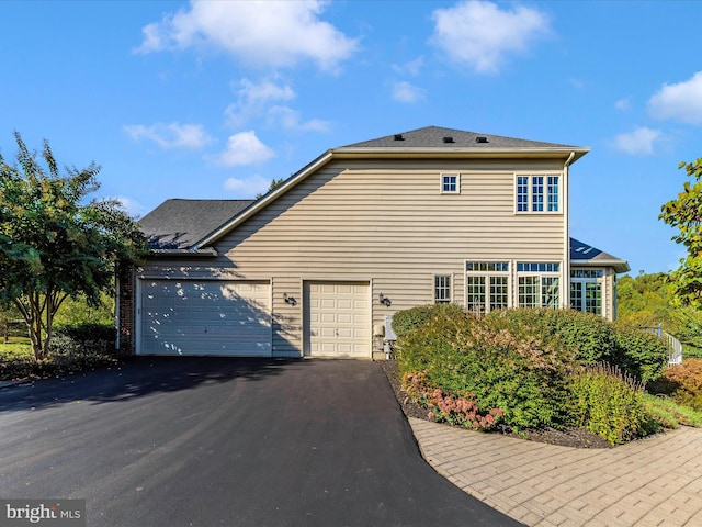 view of home's exterior featuring aphalt driveway