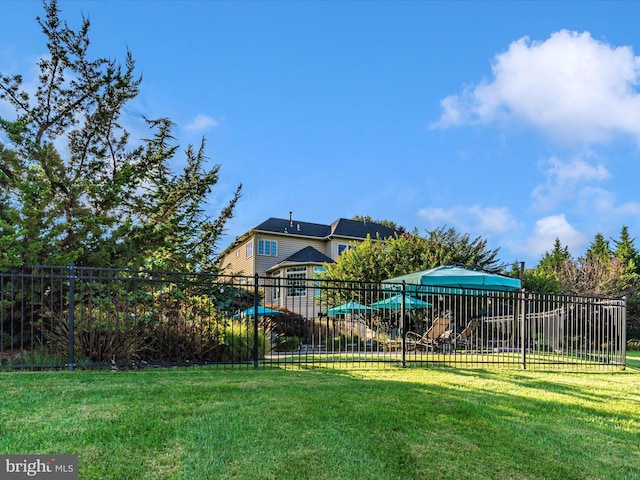 view of yard with playground community and fence