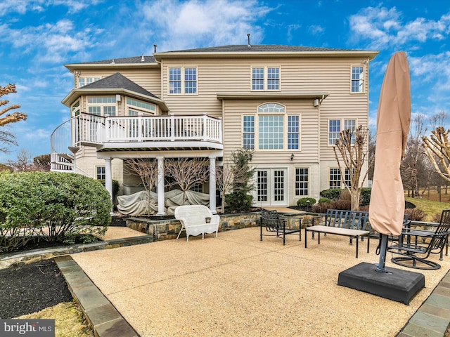 rear view of house featuring french doors and a patio