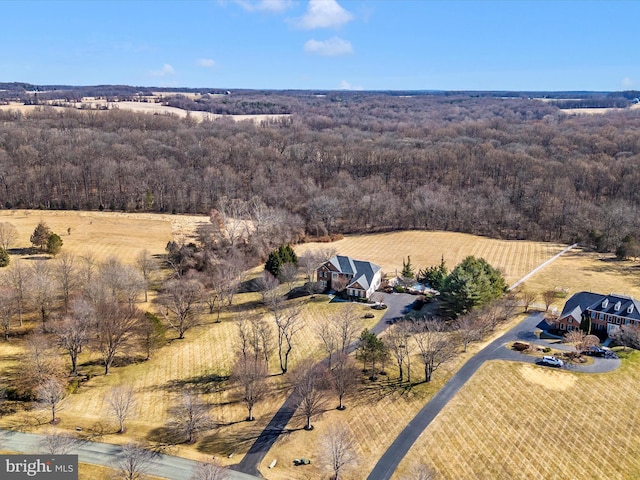 drone / aerial view with a view of trees