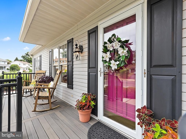 wooden terrace with a porch