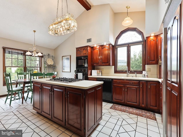 kitchen featuring light countertops, a notable chandelier, visible vents, and black appliances