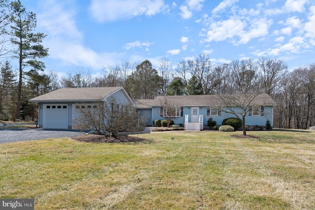 single story home with a garage, driveway, and a front yard