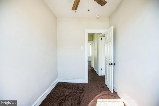 interior space with ceiling fan, baseboards, and carpet floors