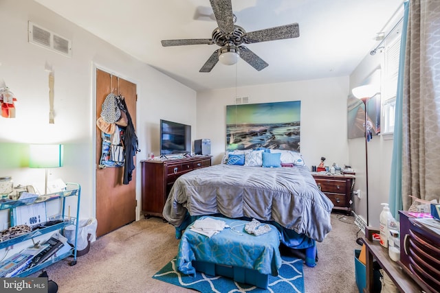 bedroom featuring a ceiling fan, carpet, and visible vents