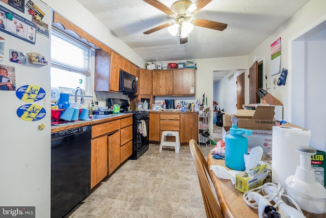 kitchen featuring a textured ceiling, black appliances, brown cabinetry, and a ceiling fan