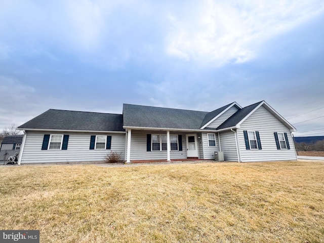 ranch-style home with central AC and a front lawn