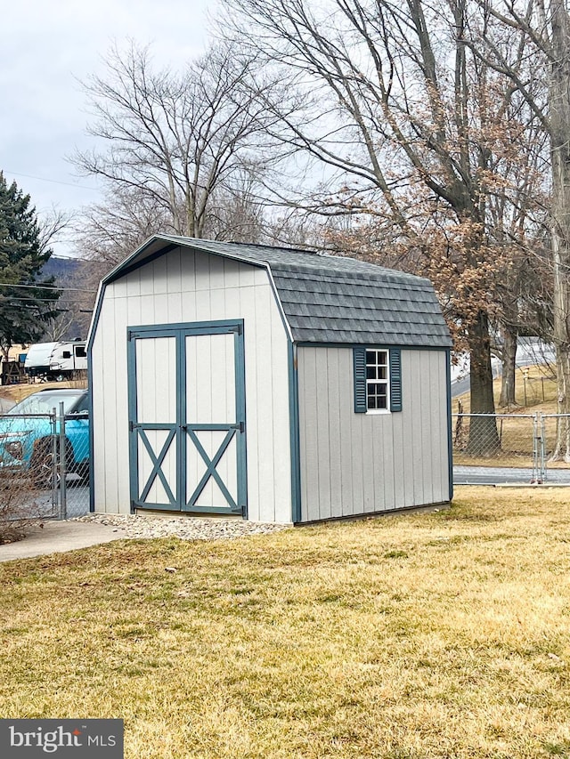 view of shed with a gate and fence