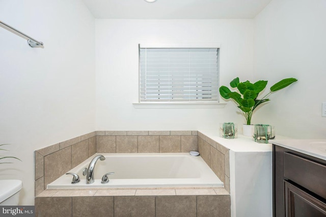 full bathroom with toilet, a bath, and vanity