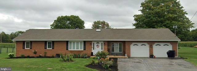13176 Gearhart Rd, Greencastle, PA 17225 - single story home with brick siding, aphalt driveway, a shingled roof, a front lawn, and an attached garage