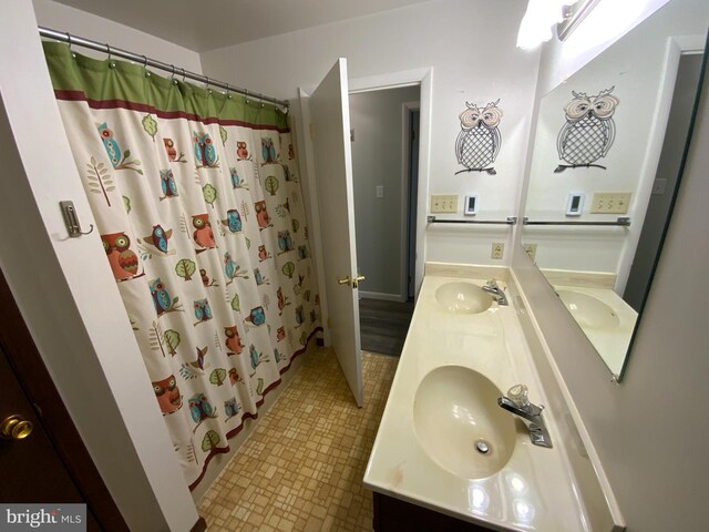 13176 Gearhart Rd, Greencastle, PA 17225 - full bath featuring tile patterned floors, a shower with curtain, double vanity, and a sink