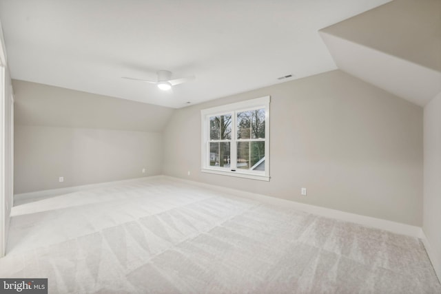 bonus room featuring visible vents, baseboards, vaulted ceiling, carpet floors, and a ceiling fan