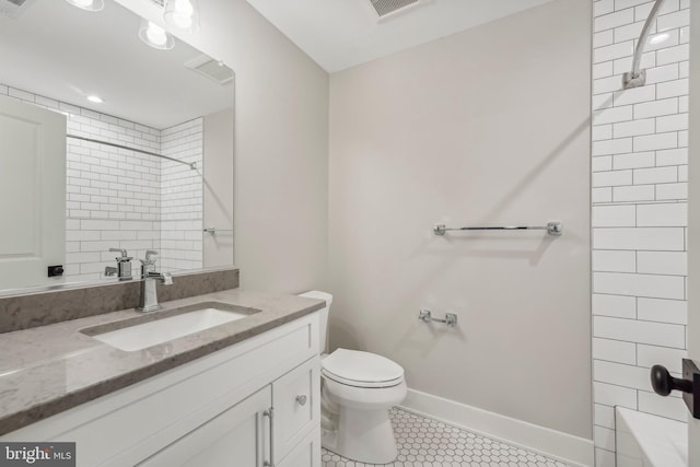 bathroom with tile patterned floors, visible vents, toilet, baseboards, and vanity