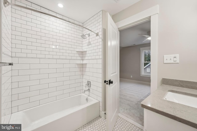 bathroom with baseboards, vanity, shower / bathtub combination, and tile patterned flooring