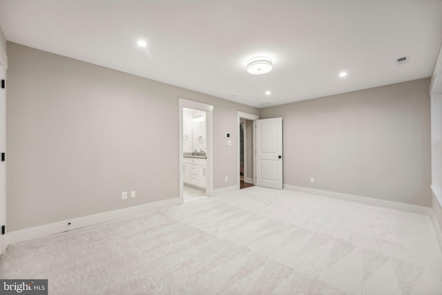 unfurnished bedroom featuring recessed lighting, visible vents, light colored carpet, and baseboards