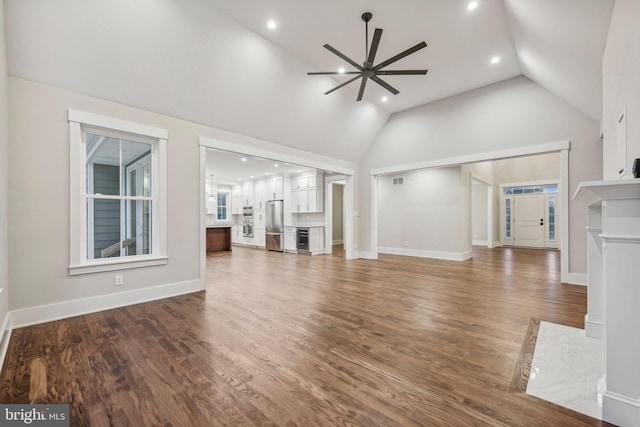 unfurnished living room with recessed lighting, baseboards, a ceiling fan, and wood finished floors