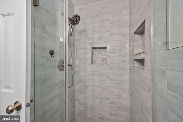 full bath with a shower stall