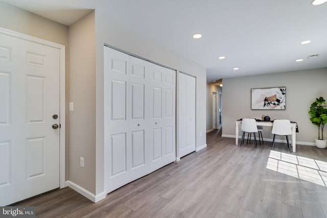 entrance foyer featuring recessed lighting, wood finished floors, and baseboards