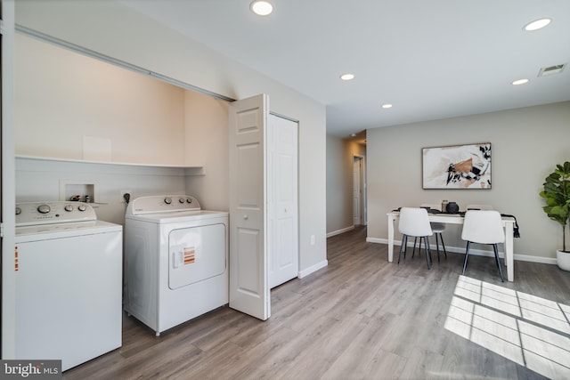 laundry room featuring visible vents, light wood finished floors, laundry area, recessed lighting, and washing machine and dryer