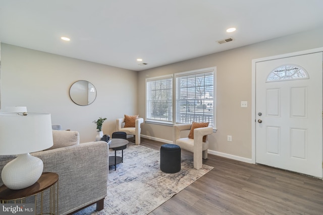 foyer with recessed lighting, wood finished floors, visible vents, and baseboards