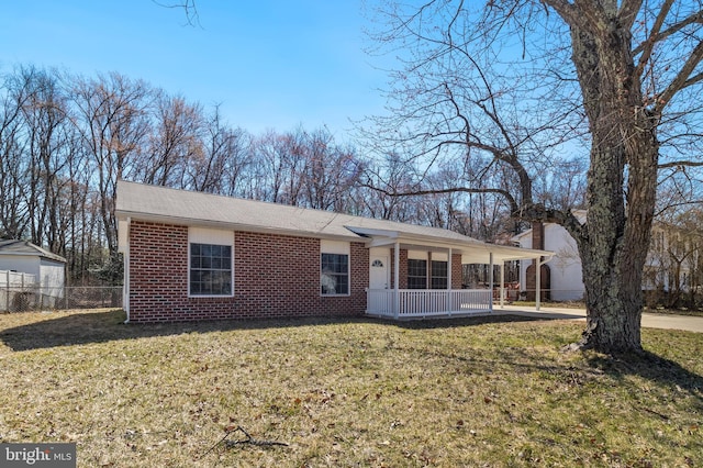 single story home with a front lawn, fence, covered porch, and brick siding