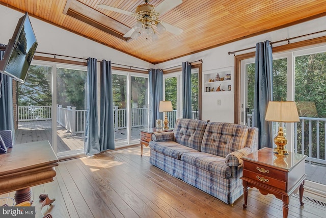 living area with vaulted ceiling, ceiling fan, wood-type flooring, and wooden ceiling