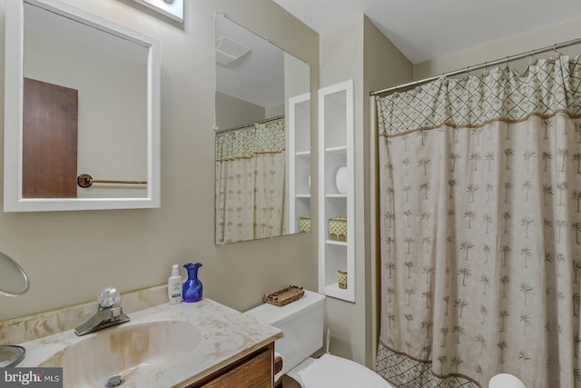 full bathroom featuring toilet and vanity