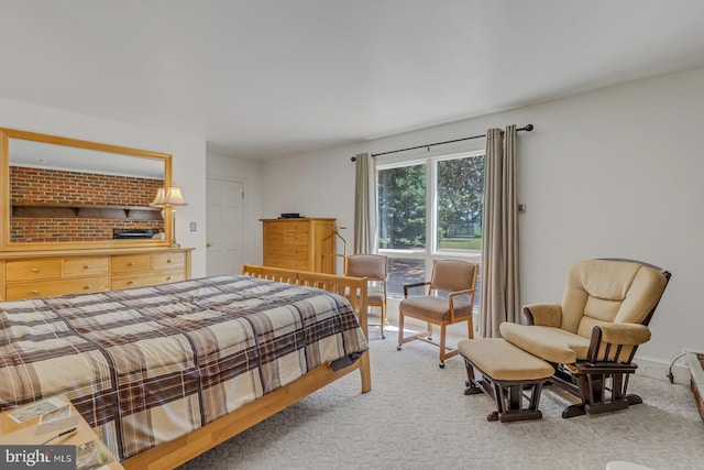 bedroom featuring carpet and baseboards