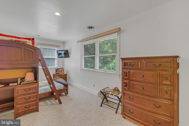 bedroom featuring light carpet, multiple windows, recessed lighting, and baseboards