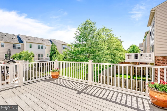 wooden terrace with a residential view