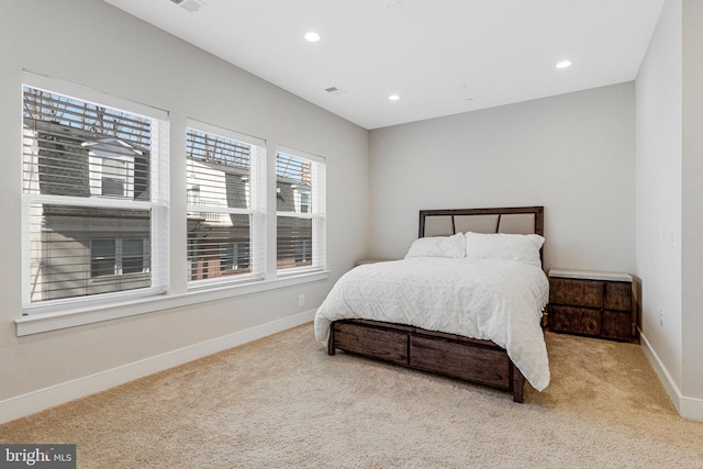 bedroom with visible vents, recessed lighting, carpet, and baseboards