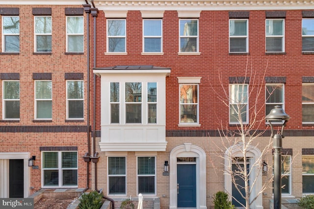 view of property with brick siding