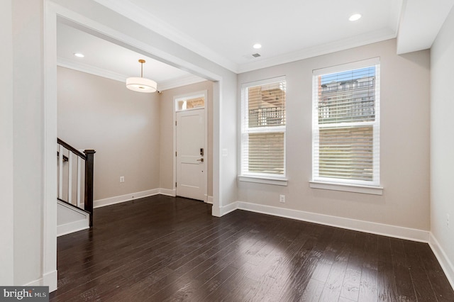 foyer entrance with dark wood-style floors, recessed lighting, crown molding, baseboards, and stairs