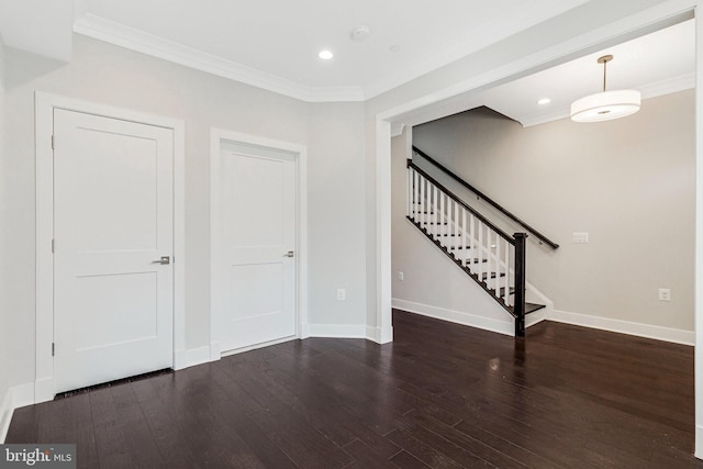 interior space with wood finished floors, baseboards, recessed lighting, ornamental molding, and stairs