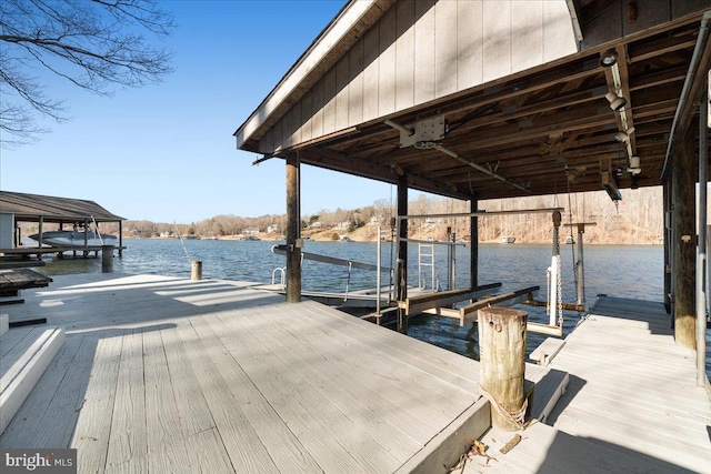 dock area featuring a water view and boat lift