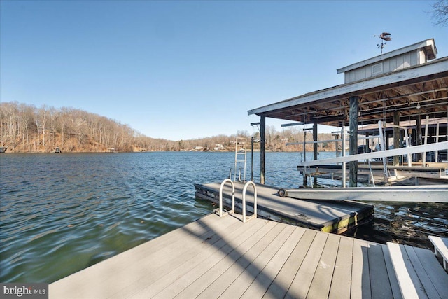 view of dock with a water view and boat lift