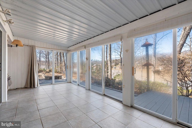 unfurnished sunroom featuring plenty of natural light