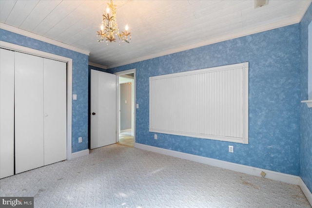 unfurnished bedroom with wallpapered walls, baseboards, an inviting chandelier, carpet, and crown molding