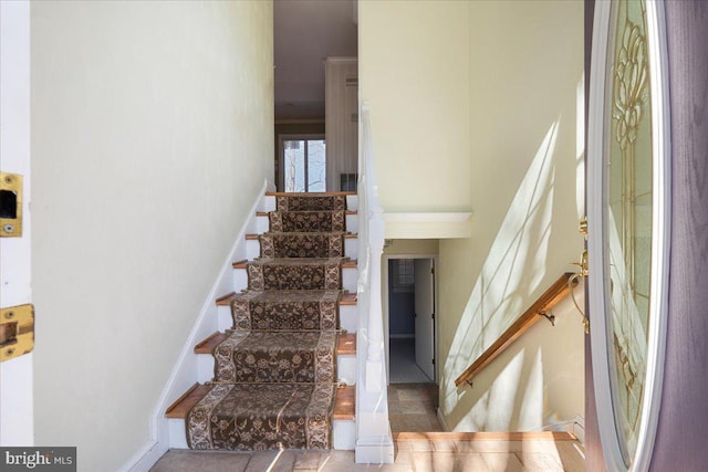 staircase featuring baseboards