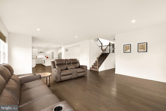 living area featuring dark wood-style floors, recessed lighting, stairway, and baseboards