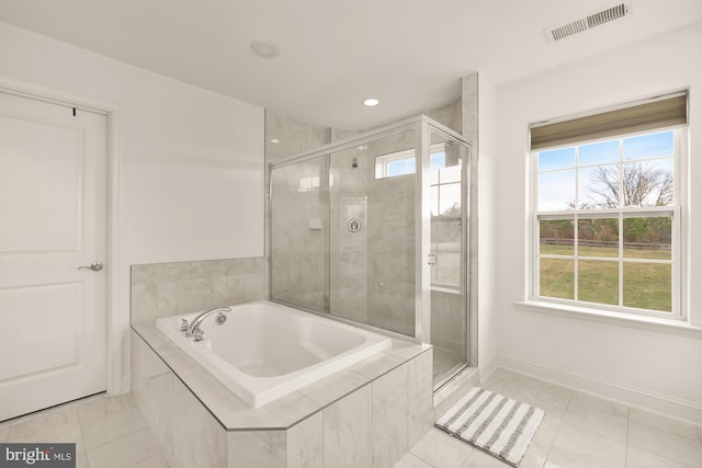 full bathroom featuring a garden tub, recessed lighting, visible vents, a stall shower, and baseboards