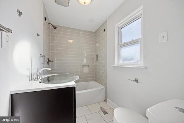 full bathroom with visible vents, baseboards, toilet, shower / bathing tub combination, and vanity