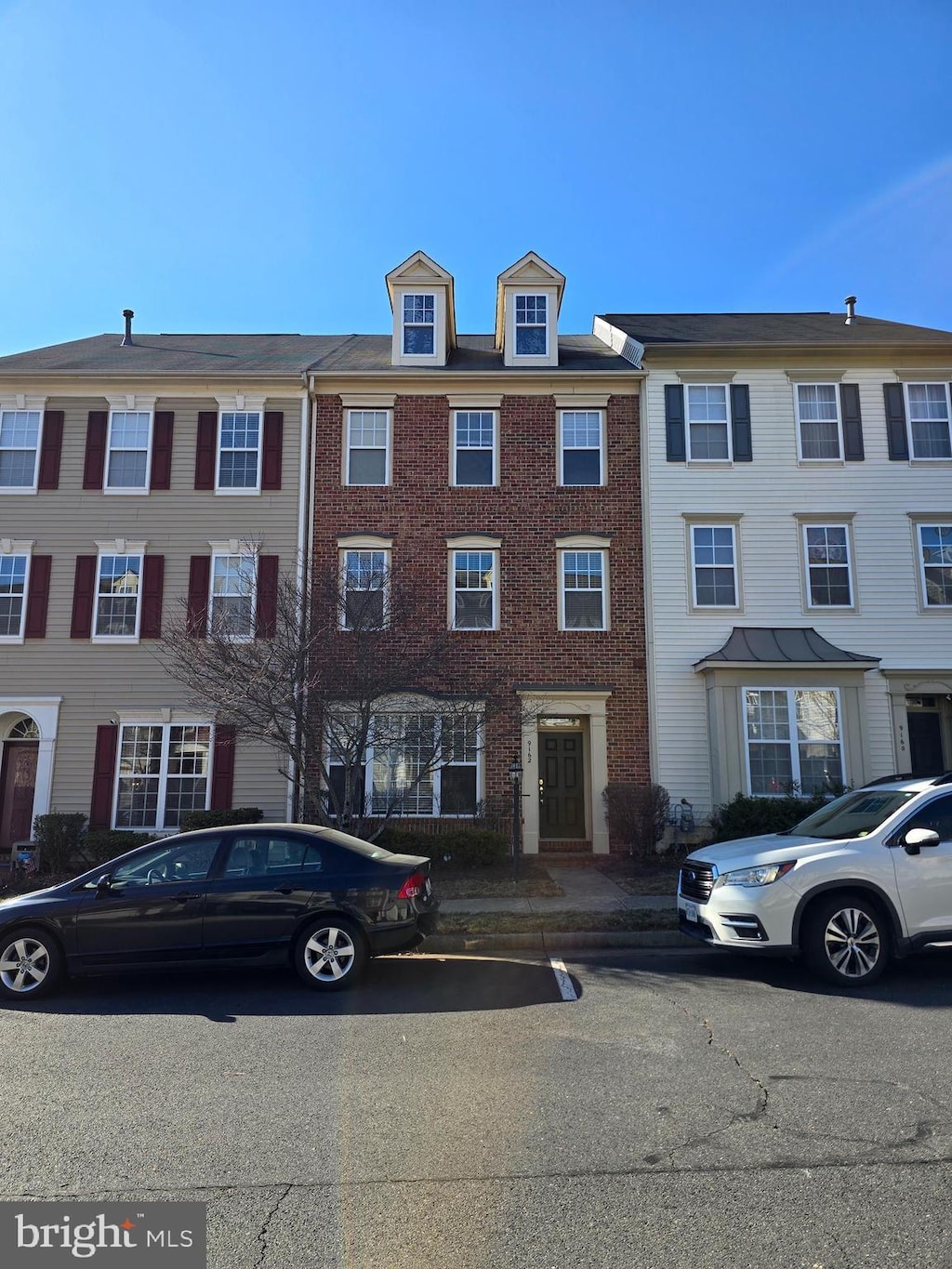 view of front of house with brick siding