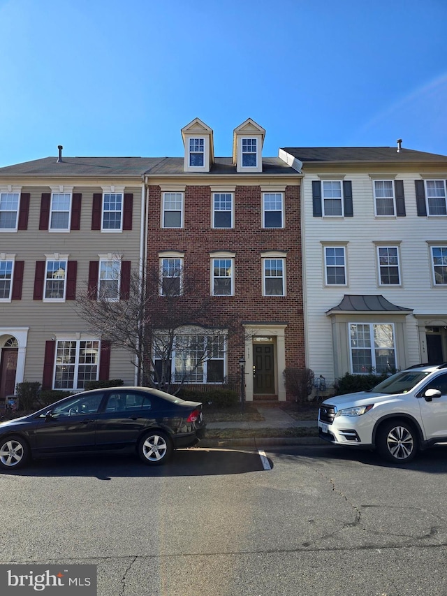 view of front of house with brick siding