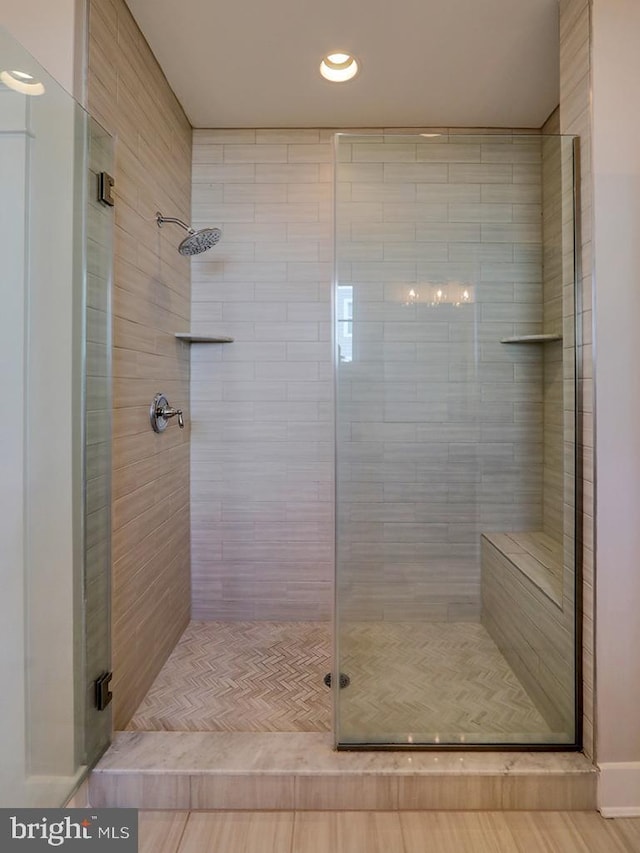 full bath featuring a shower stall