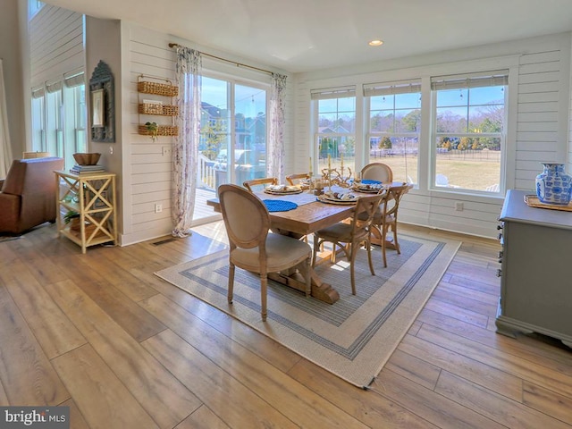 dining space featuring light wood-style flooring and recessed lighting