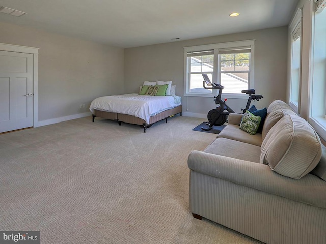 carpeted bedroom featuring recessed lighting, visible vents, and baseboards