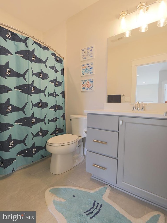 bathroom with vanity, a shower with shower curtain, tile patterned flooring, and toilet