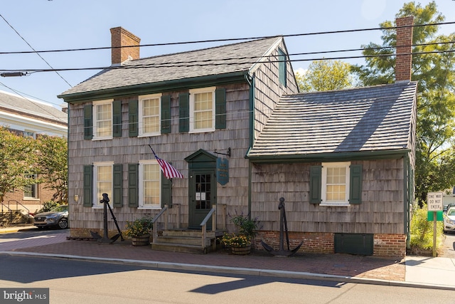 view of front of home with a chimney