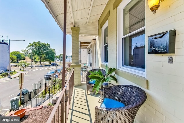 balcony featuring covered porch